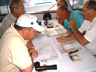Students study the charts
