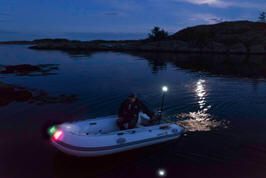 Properly lighted dinghy at night.